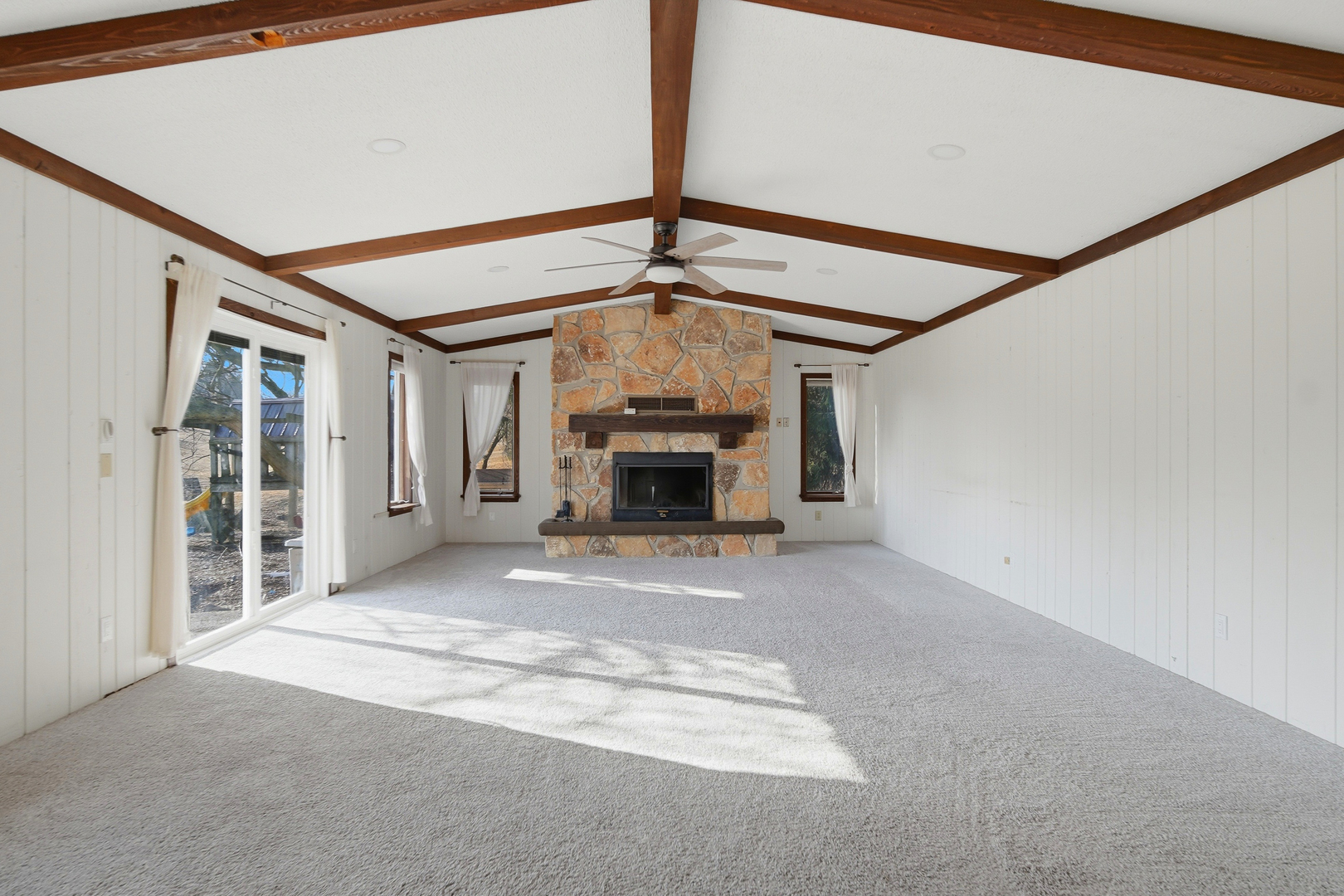 13831 Prairie Center Road Morrison, IL 61270 - Photo 12 of 32 a view of empty room with fireplace and windows