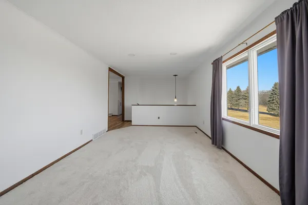 a view of an empty room with a window