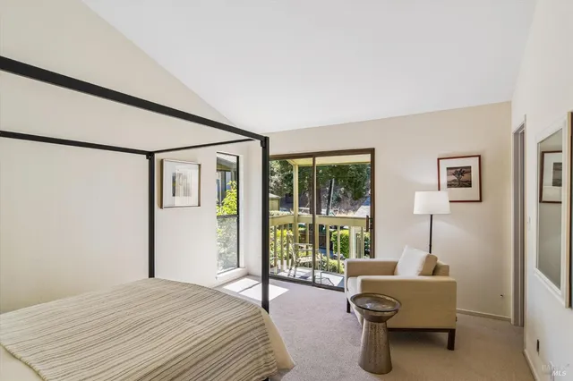 a bedroom with furniture and a window