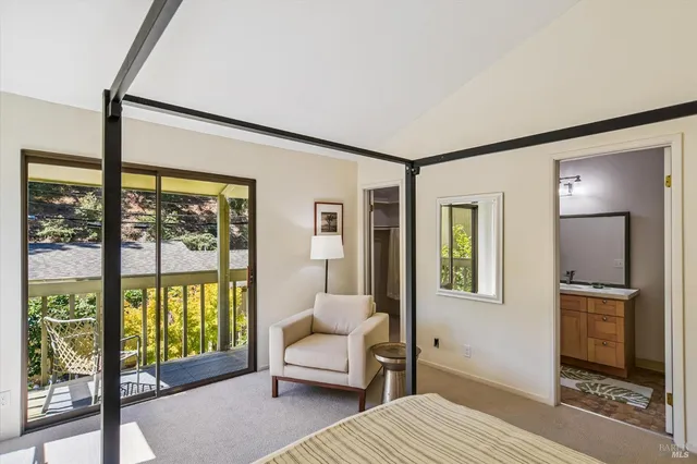 a bedroom with furniture and a window