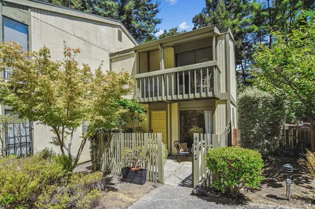 a view of a house with brick walls