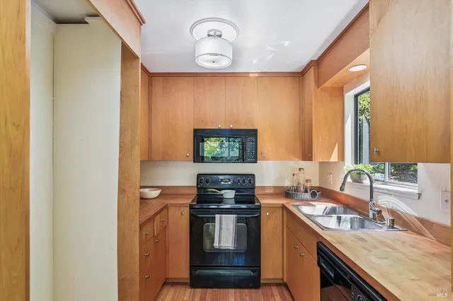 a kitchen with a stove and a sink