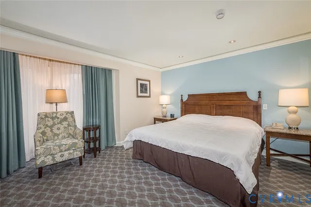 a bedroom with a bed and a lamp