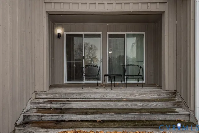 a view of fireplace and glass door
