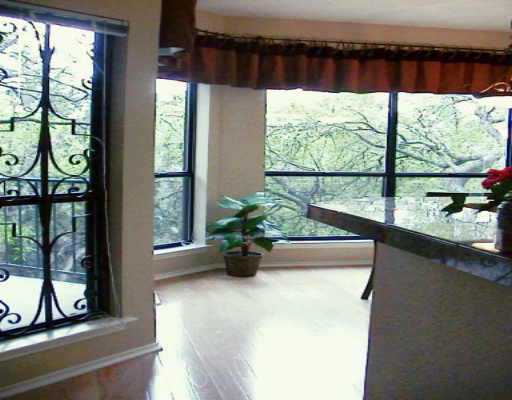 4711 Spicewood Springs Road, Unit 142 Austin, TX 78759 - Photo 1 of 1 a view of a living room with furniture and floor to ceiling window