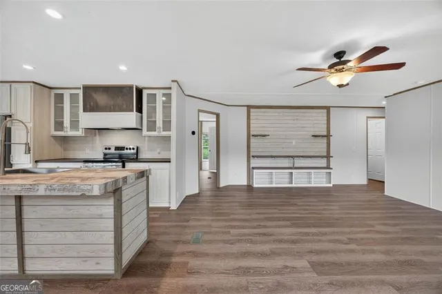 a kitchen with stainless steel appliances granite countertop a stove and a refrigerator