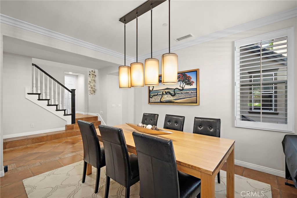 8 Ranunculus Street Ladera Ranch, CA 92694 - Photo 11 of 39 a view of a dining room with furniture