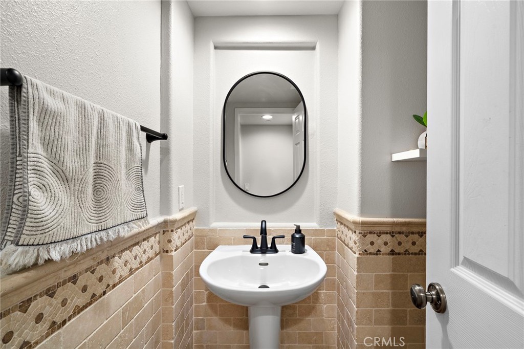 8 Ranunculus Street Ladera Ranch, CA 92694 - Photo 12 of 39 a bathroom with a sink and a mirror