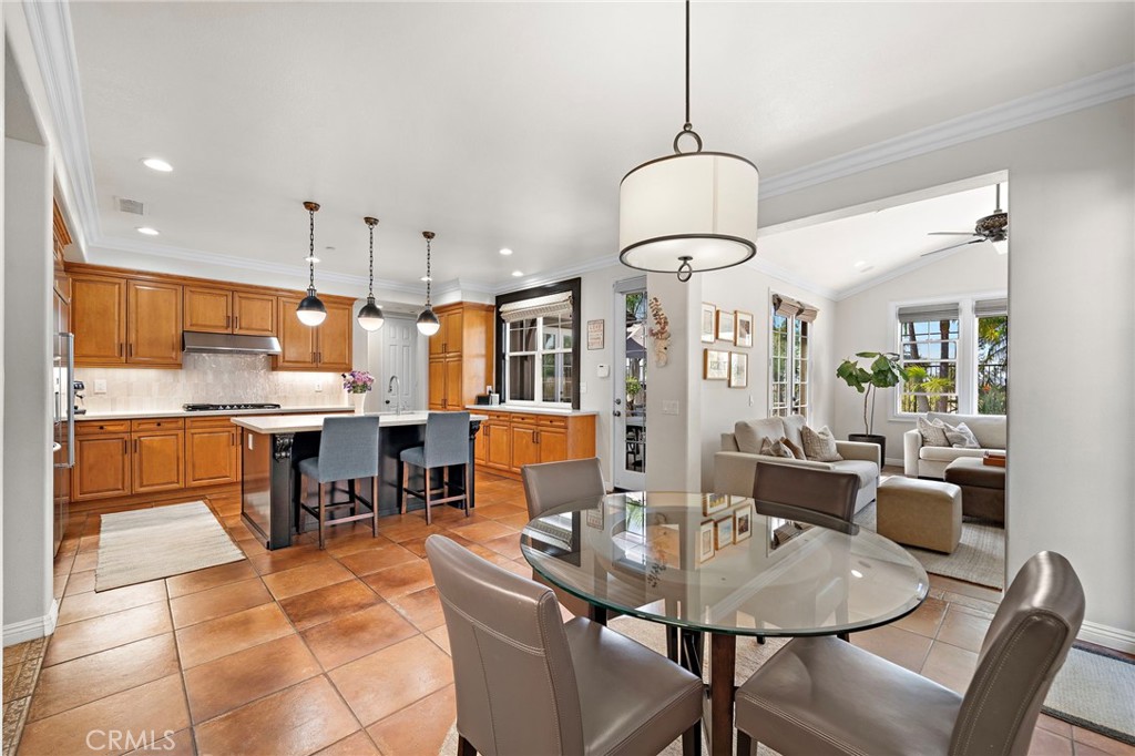 8 Ranunculus Street Ladera Ranch, CA 92694 - Photo 13 of 39 a dining room with stainless steel appliances kitchen island granite countertop a dining table chairs and view living room
