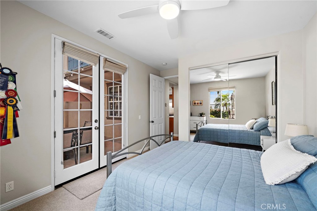 8 Ranunculus Street Ladera Ranch, CA 92694 - Photo 18 of 39 a bedroom with a bed and a large mirror