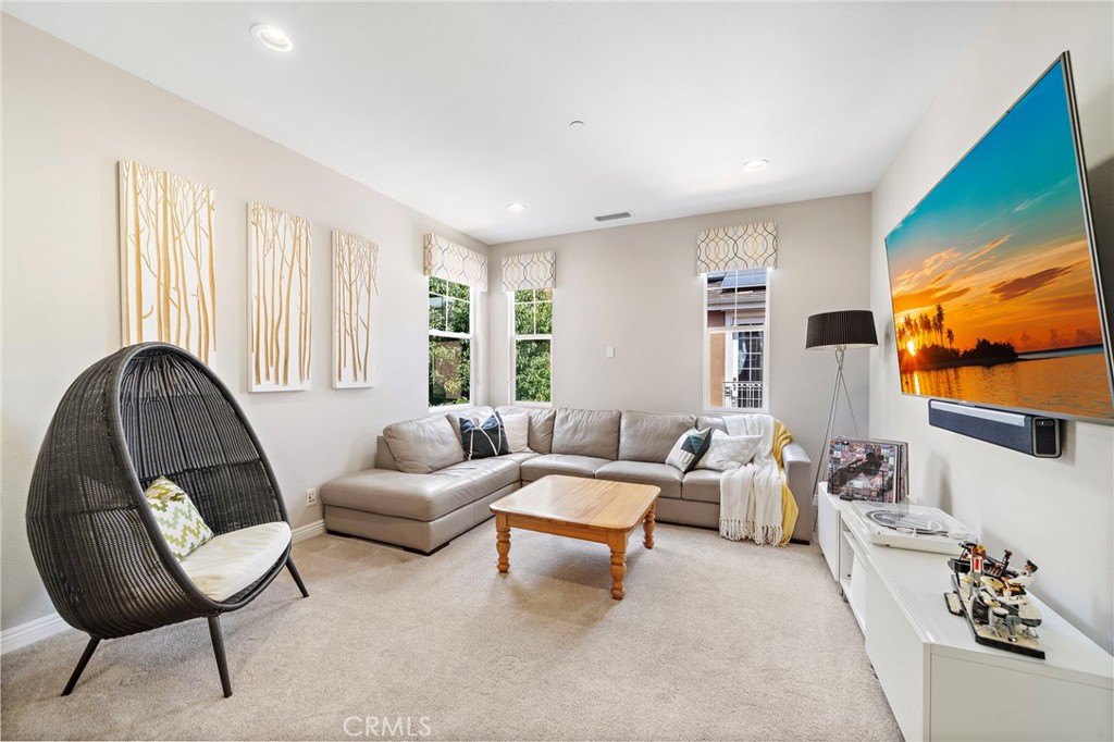 8 Ranunculus Street Ladera Ranch, CA 92694 - Photo 26 of 39 a living room with furniture and a flat screen tv