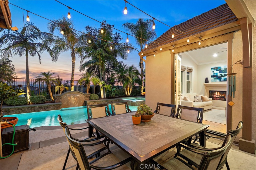 8 Ranunculus Street Ladera Ranch, CA 92694 - Photo 3 of 39 a view of a patio with a table and chairs and potted plants