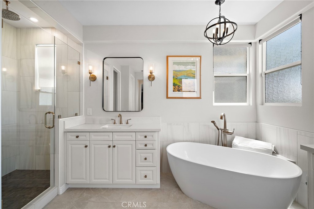 8 Ranunculus Street Ladera Ranch, CA 92694 - Photo 31 of 39 a bathroom with a double vanity sink mirror and bathtub