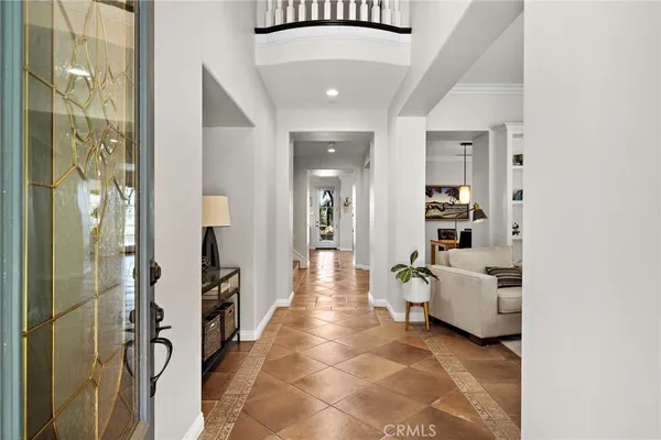 a hallway with furniture and white walls
