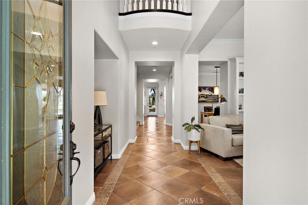 8 Ranunculus Street Ladera Ranch, CA 92694 - Photo 9 of 39 a hallway with furniture and white walls