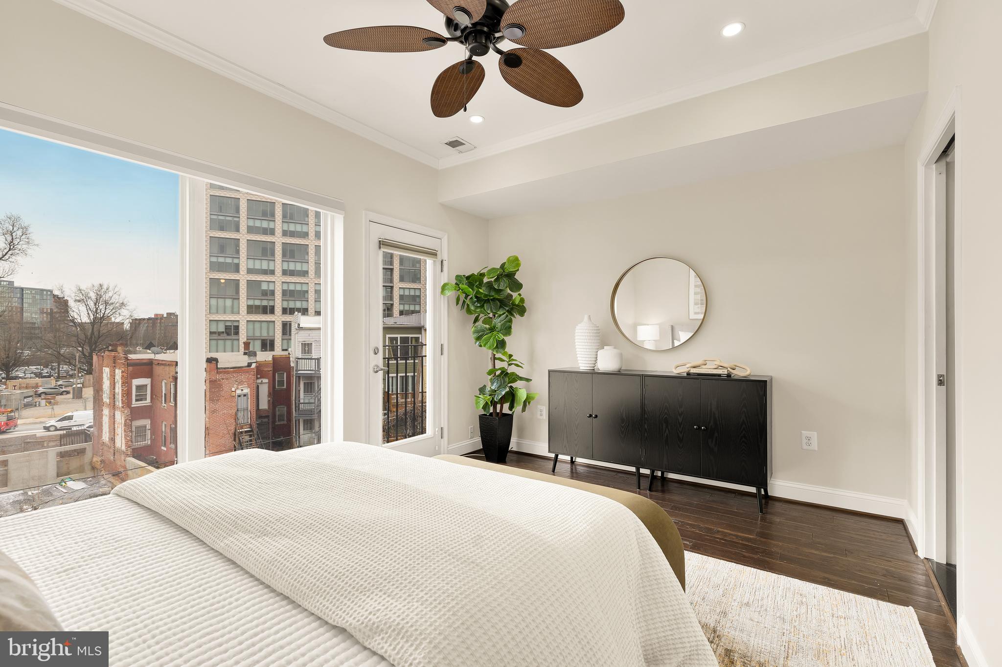 29 Q Street Northeast, Unit 2 Washington, DC 20002 - Photo 13 of 22 a bedroom with bed and a chandelier