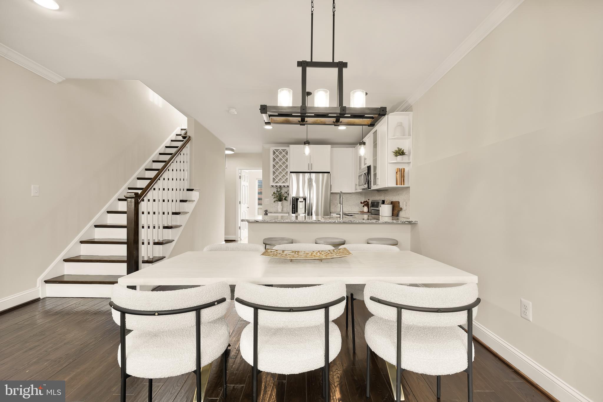 29 Q Street Northeast, Unit 2 Washington, DC 20002 - Photo 6 of 22 a view of a dining room with furniture and wooden floor