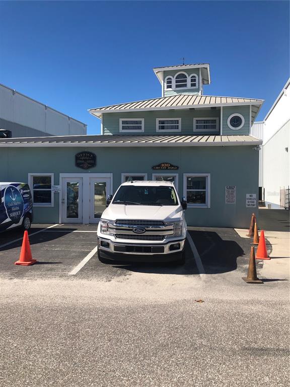 100 Circuit Road, Unit N77 Nokomis, FL 34275 - Photo 10 of 12 a car parked in front of a building