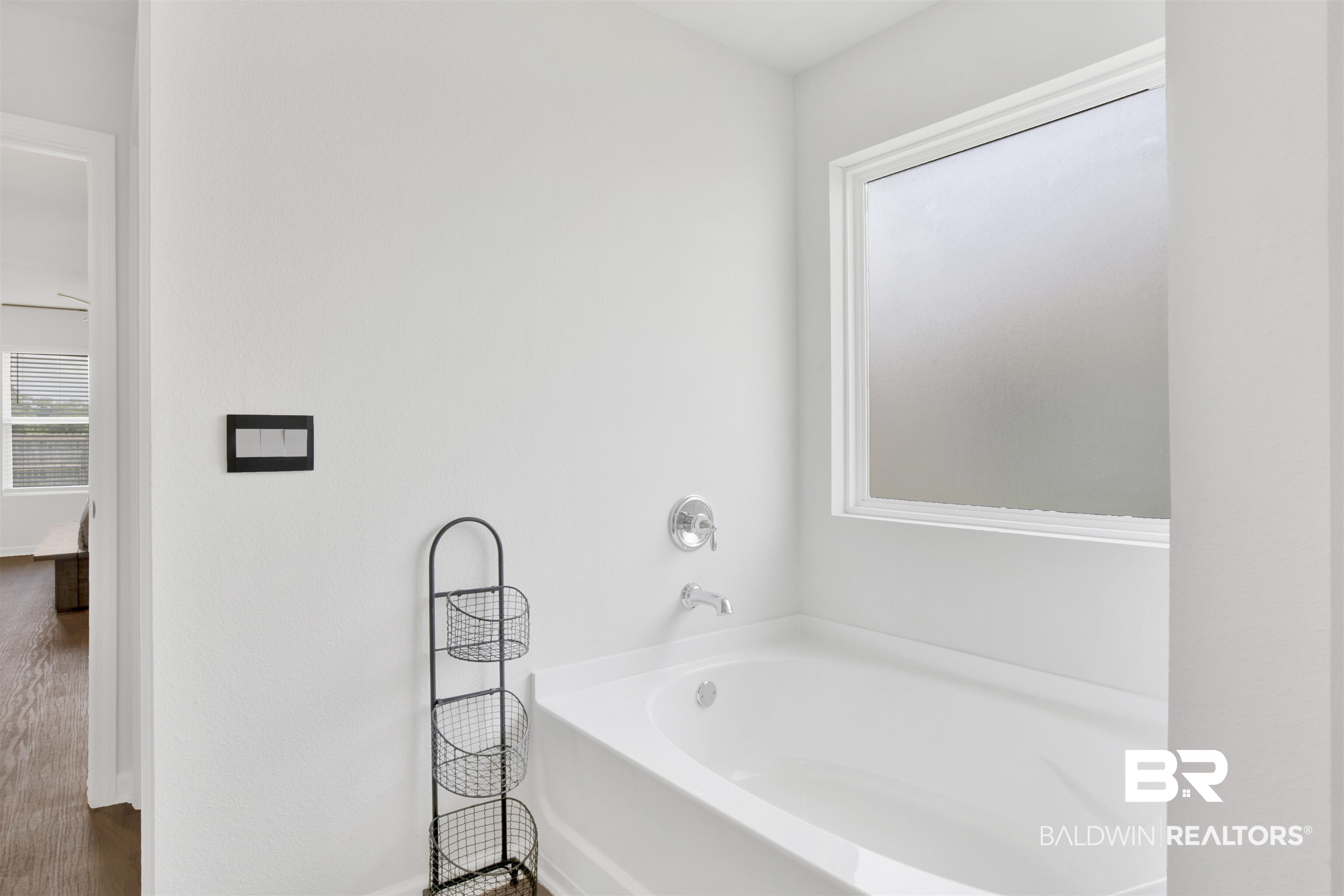 14731 Forsythia Loop Silverhill, AL 36576 - Photo 8 of 25 Bathroom with a tub to relax in and hardwood / wood-style floors