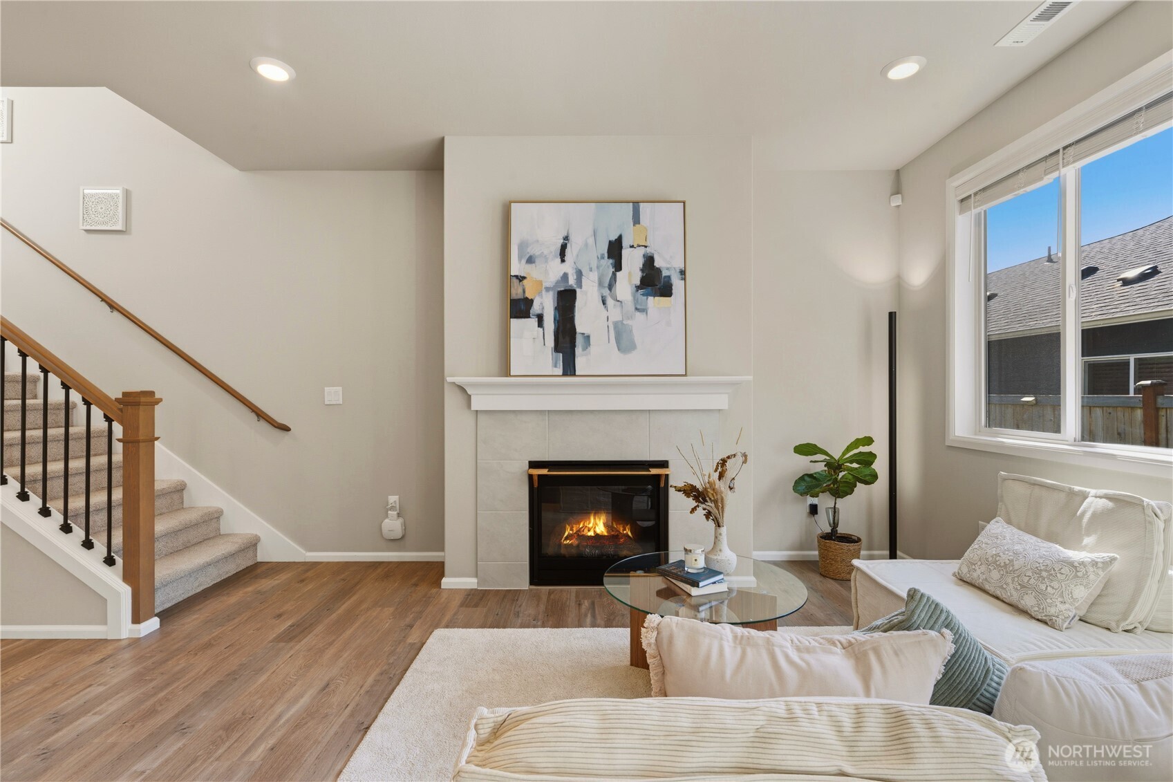 19432 9th Avenue Southeast Bothell, WA 98012 - Photo 2 of 33 a living room with furniture and a fireplace