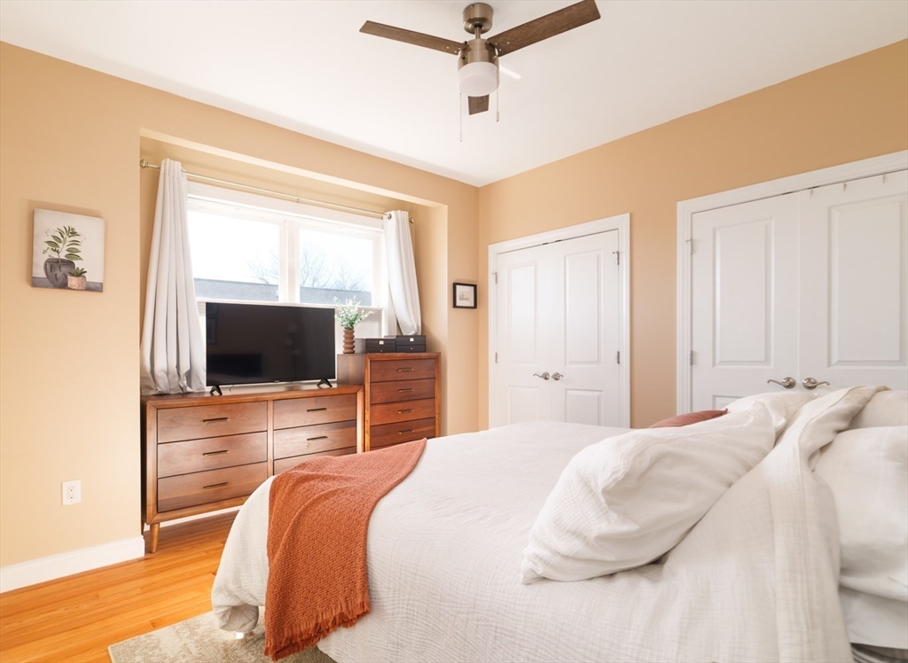 412 Meridian Street, Unit 3 Boston, MA 02128 - Photo 12 of 30 a bedroom with a bed and a flat screen tv