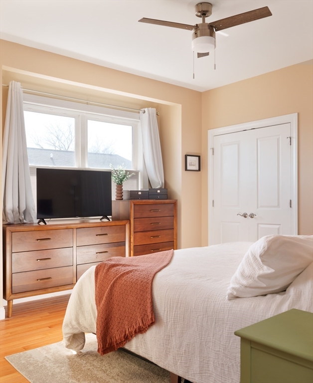 412 Meridian Street, Unit 3 Boston, MA 02128 - Photo 13 of 30 a bedroom with a bed and a flat screen tv