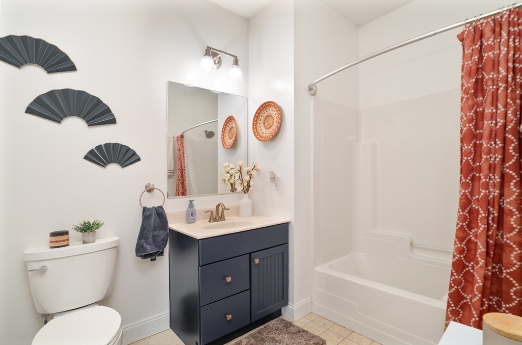 412 Meridian Street, Unit 3 Boston, MA 02128 - Photo 18 of 30 a bathroom with a sink toilet and shower