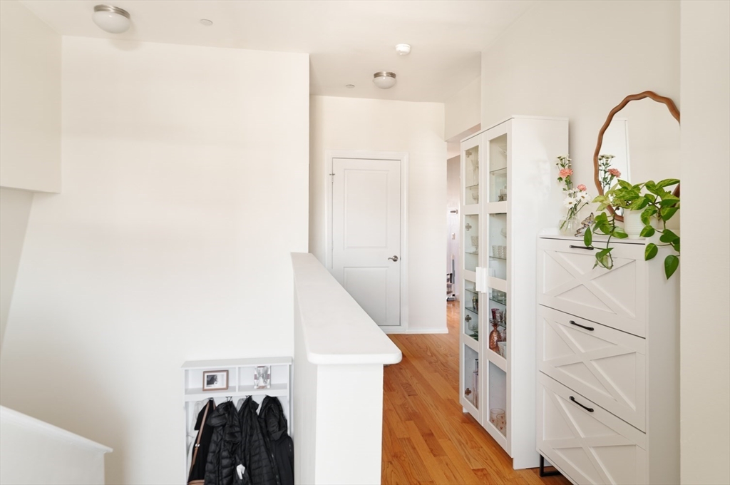 412 Meridian Street, Unit 3 Boston, MA 02128 - Photo 19 of 30 a view of walk in closet with clothes and shoes
