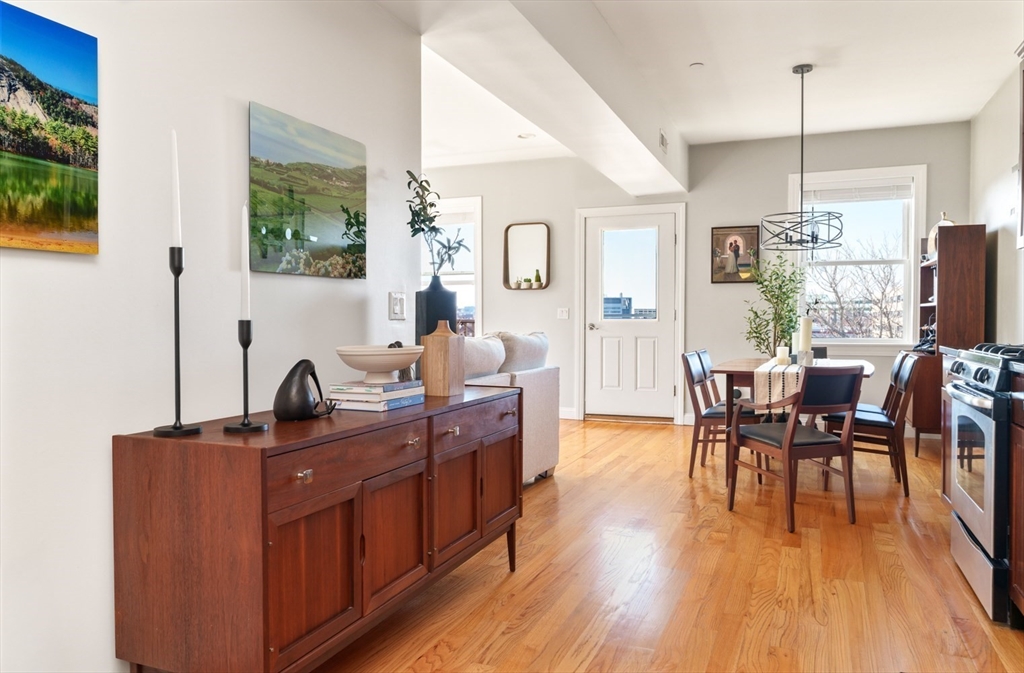 412 Meridian Street, Unit 3 Boston, MA 02128 - Photo 5 of 30 a view of a dining room with furniture window and wooden floor