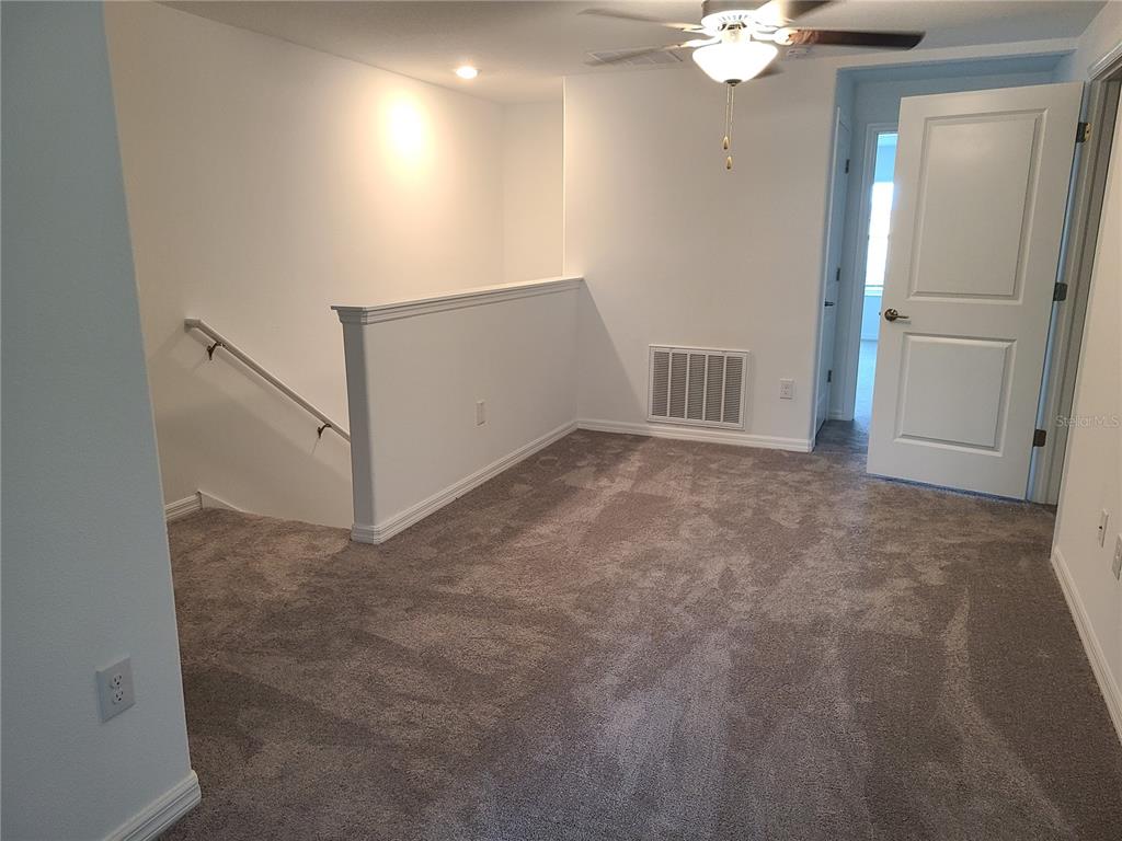 14349 Editors Note Street Ruskin, FL 33573 - Photo 12 of 20 wooden floor in an empty room