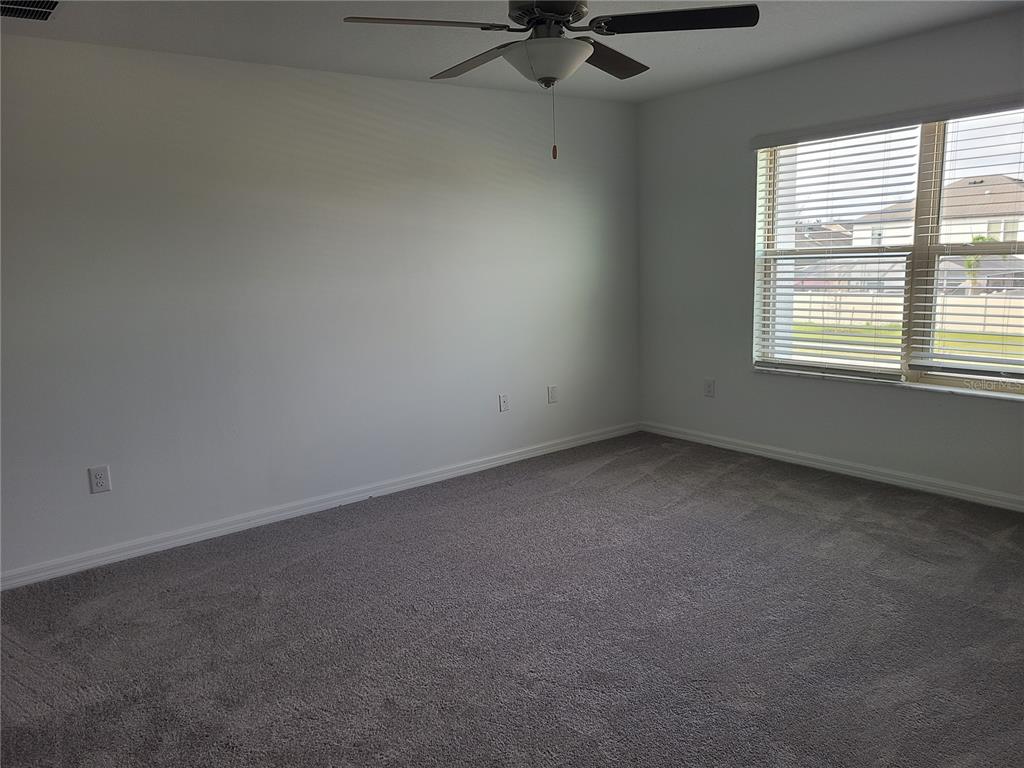 14349 Editors Note Street Ruskin, FL 33573 - Photo 16 of 20 an empty room with a window