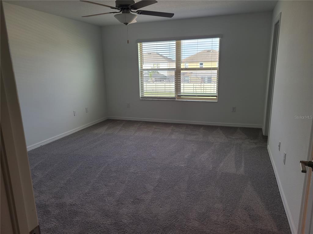 14349 Editors Note Street Ruskin, FL 33573 - Photo 19 of 20 an empty room with a window