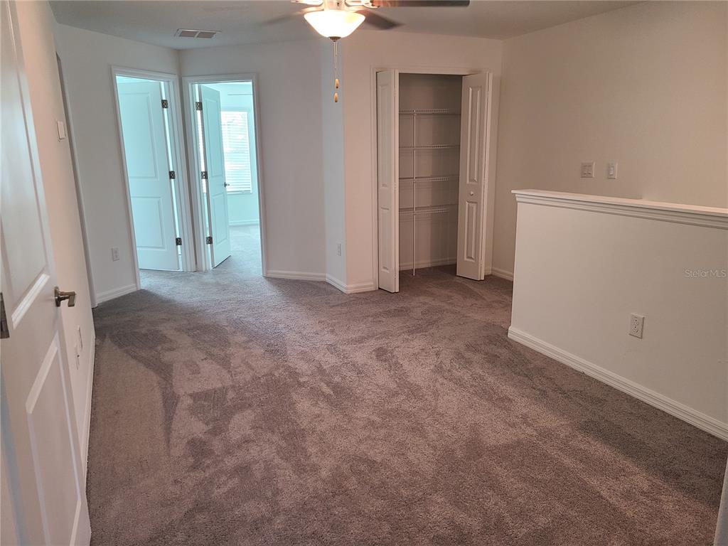 14349 Editors Note Street Ruskin, FL 33573 - Photo 20 of 20 an empty room with a bathroom