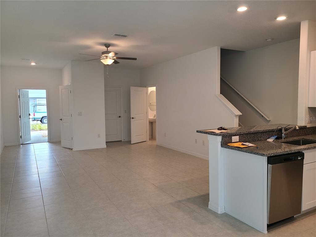 14349 Editors Note Street Ruskin, FL 33573 - Photo 2 of 20 a view of a kitchen with a sink and chandelier