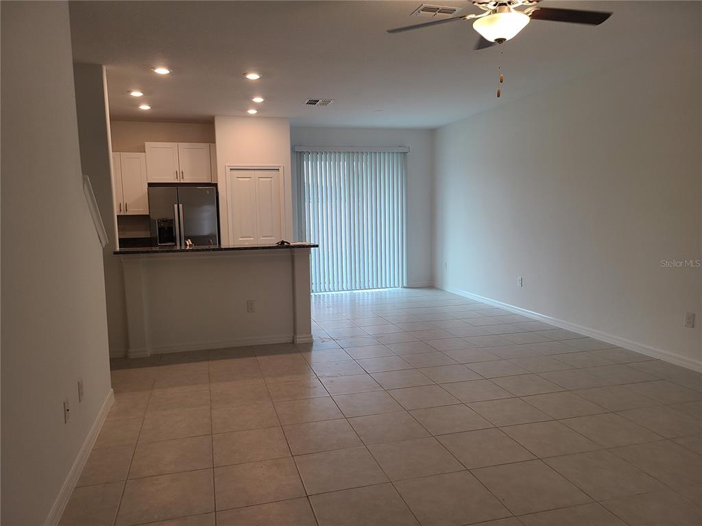 14349 Editors Note Street Ruskin, FL 33573 - Photo 5 of 20 a kitchen with a sink cabinets and stainless steel appliances