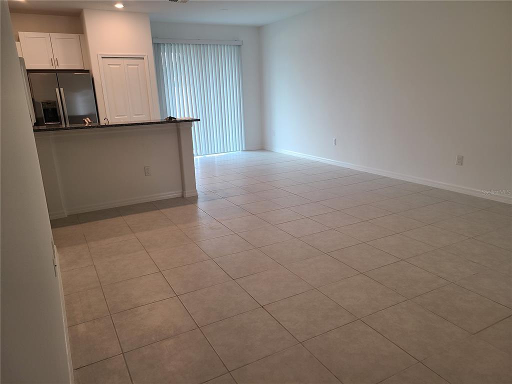 14349 Editors Note Street Ruskin, FL 33573 - Photo 6 of 20 an empty room with kitchen view