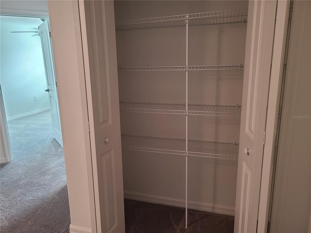 14349 Editors Note Street Ruskin, FL 33573 - Photo 10 of 20 a view of a room with rack on the wall