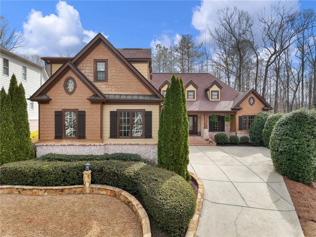 6147 Golf View Court Jefferson, GA 30549 - Photo 2 of 73 a front view of a house with garden