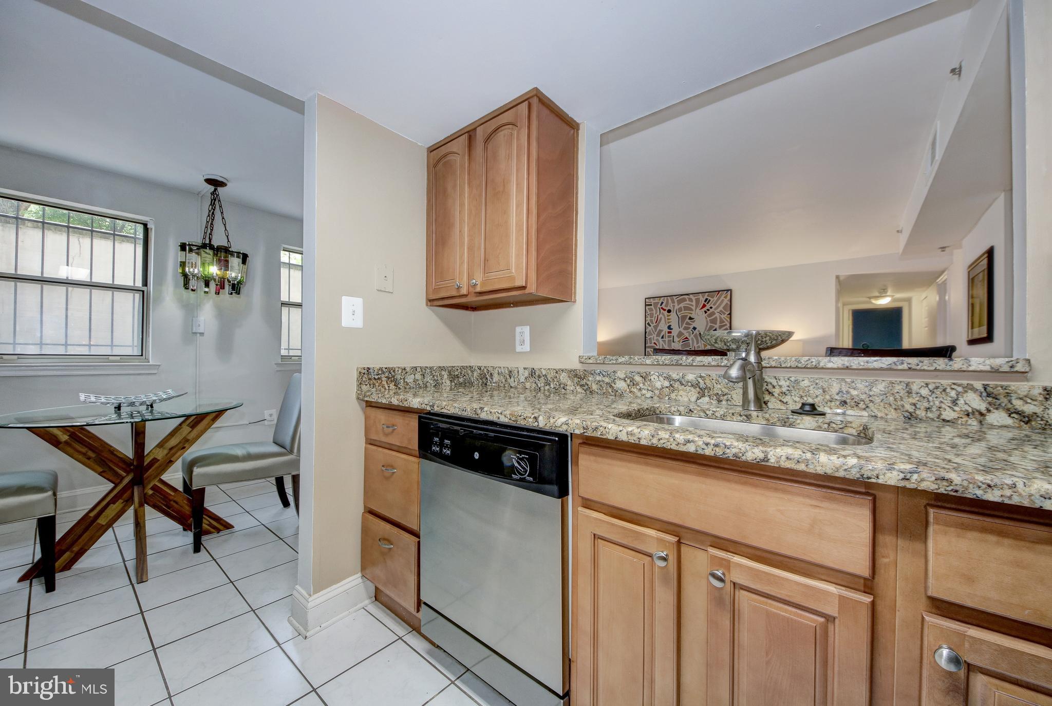 1621 T Street Northwest, Unit T2 Washington, DC 20009 - Photo 9 of 41 Kitchen opens to living room with pass-through
