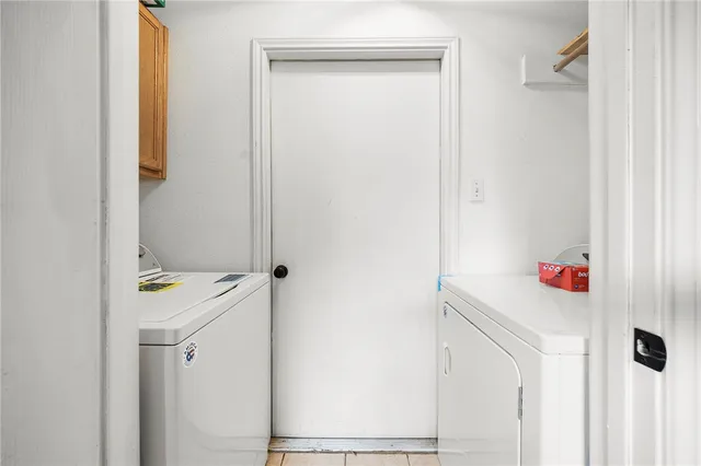 a room with a window and washer