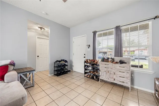 a bedroom with furniture and a window