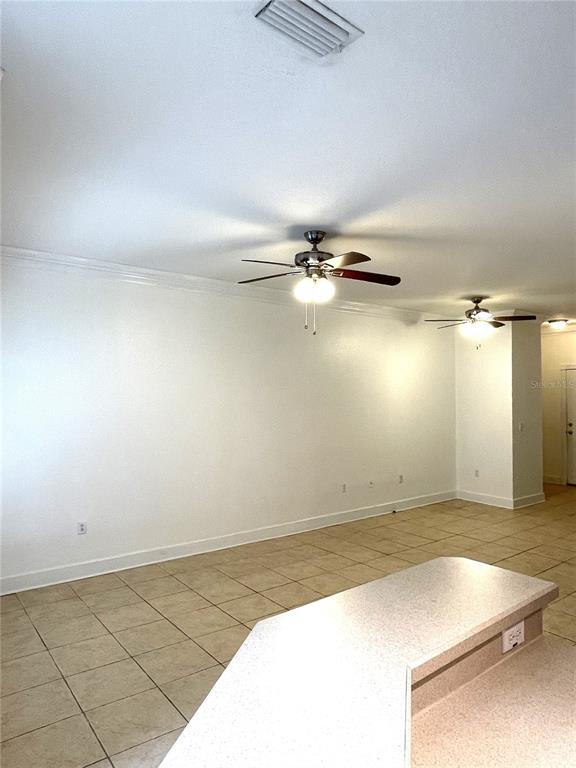 4282 Morton Court Lakeland, FL 33813 - Photo 15 of 72 an empty room with chandelier fan
