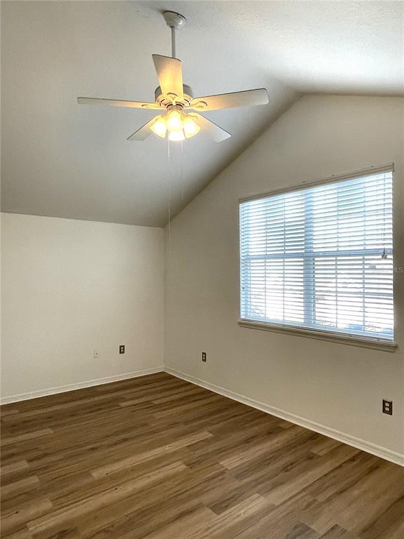 4282 Morton Court Lakeland, FL 33813 - Photo 28 of 72 an empty room with wooden floor and windows