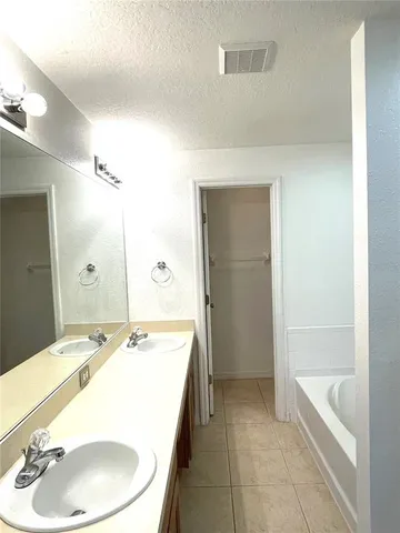 a white toilet sitting next to a shower