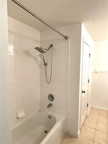 a bathroom with a shower and a sink