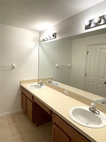 a white toilet sitting next to a shower