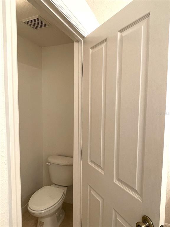4282 Morton Court Lakeland, FL 33813 - Photo 40 of 72 a white toilet sitting next to a shower