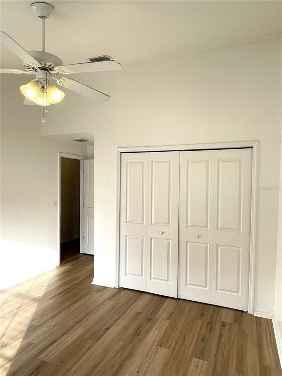 4282 Morton Court Lakeland, FL 33813 - Photo 43 of 72 a view of an empty room with wooden floor