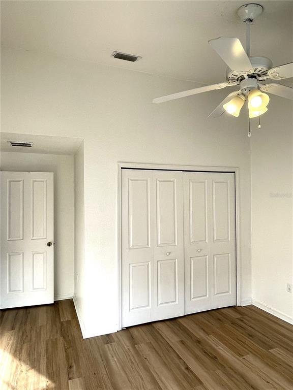 4282 Morton Court Lakeland, FL 33813 - Photo 44 of 72 a view of an empty room with wooden floor