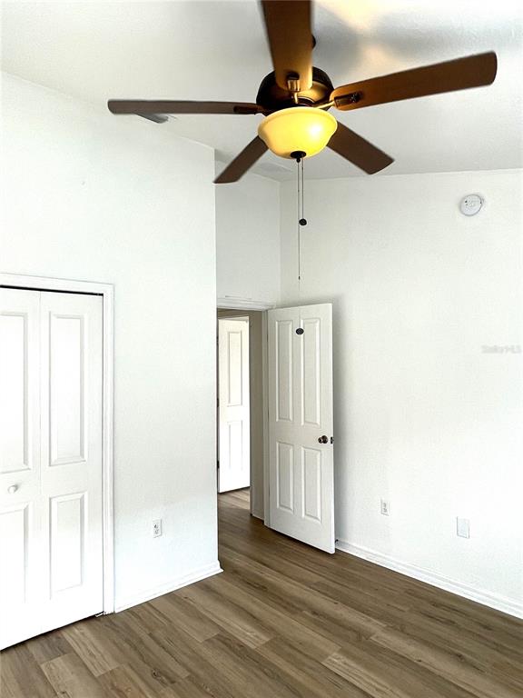 4282 Morton Court Lakeland, FL 33813 - Photo 47 of 72 an empty room with wooden floor fan and windows